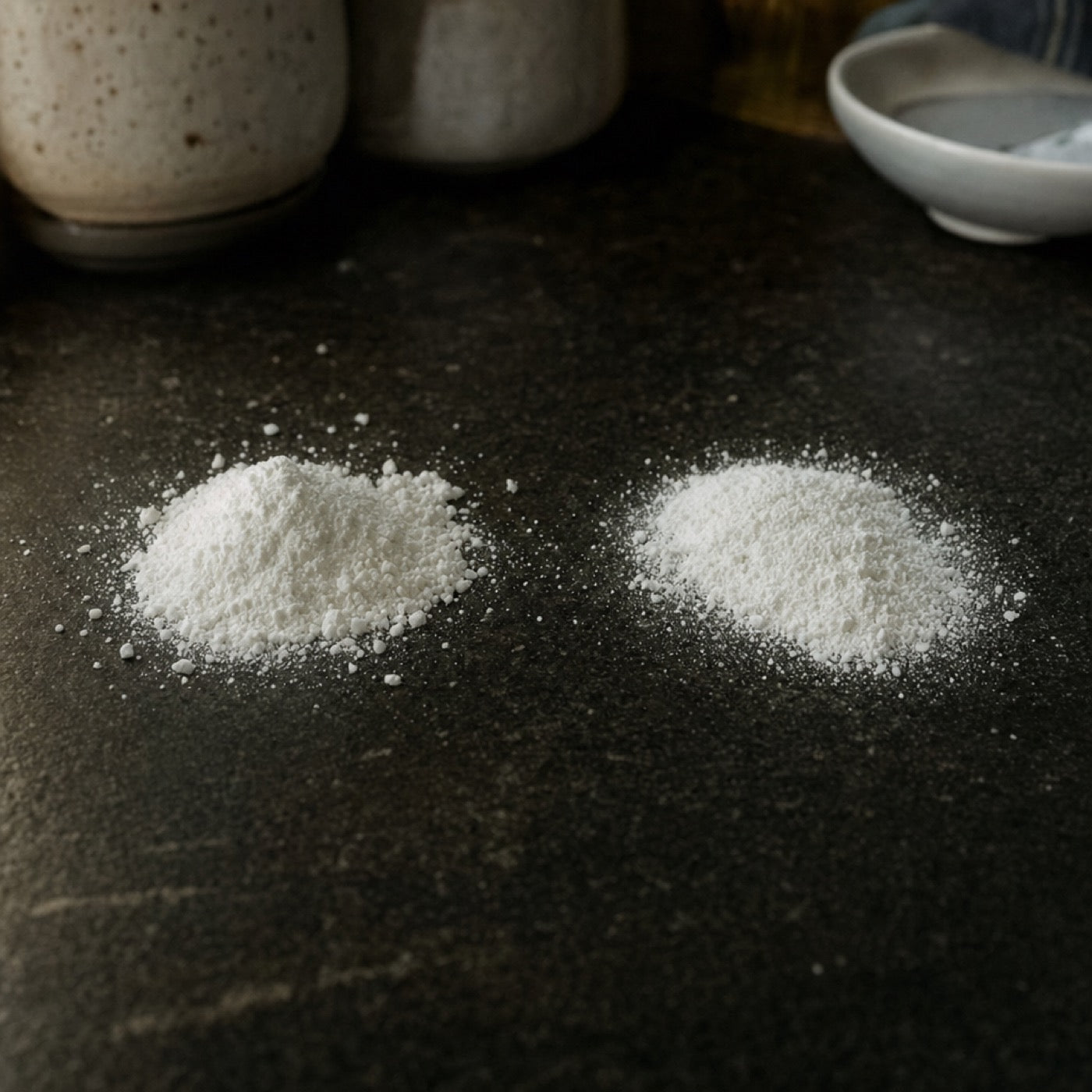 Two small heaps of white powder side by side, visually near identical
