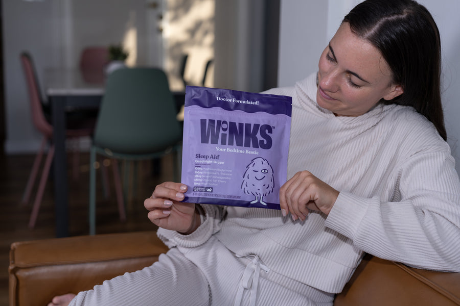 Customer holding a Winks pouch