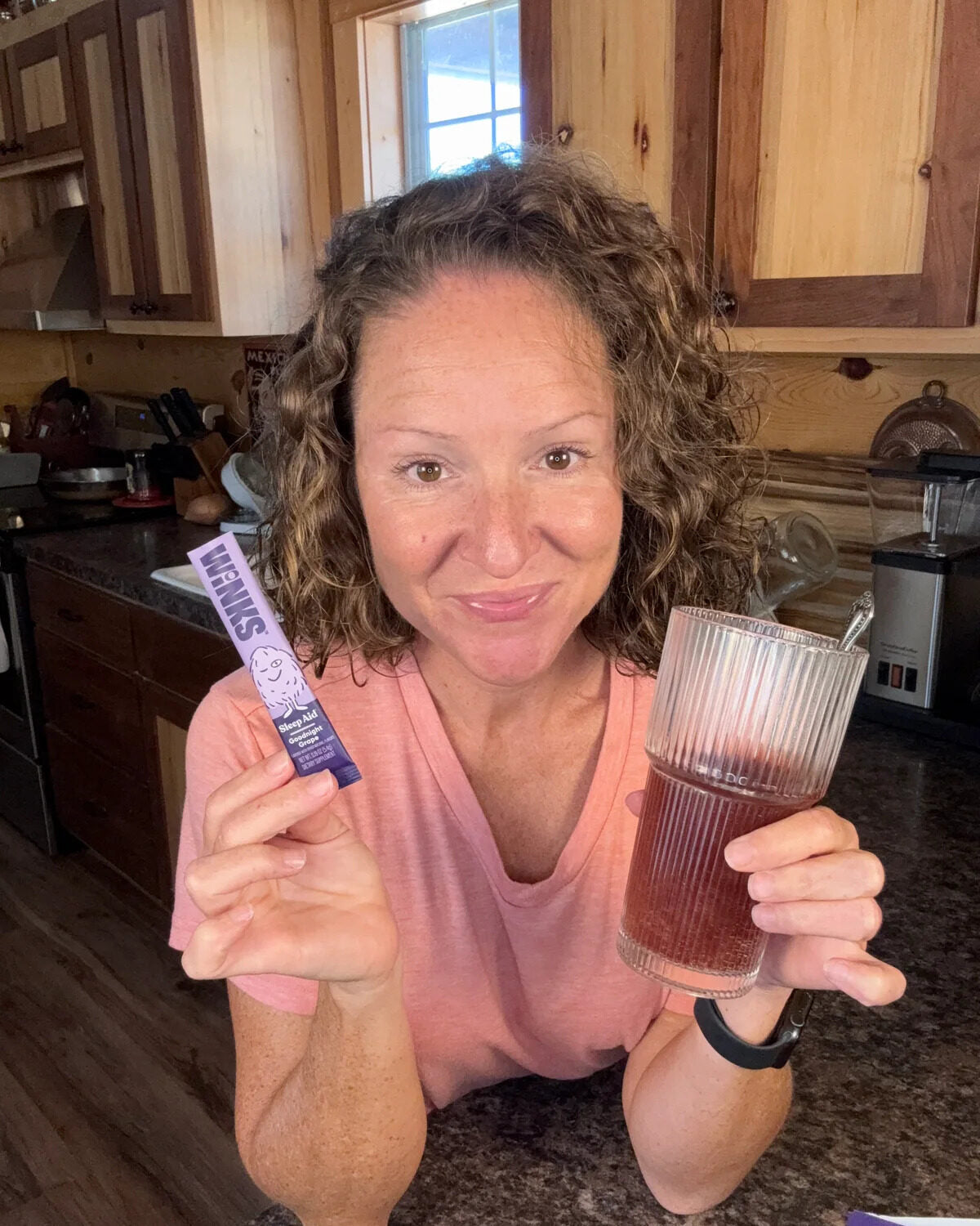 Customer with a prepared glass of Goodnight Grape
